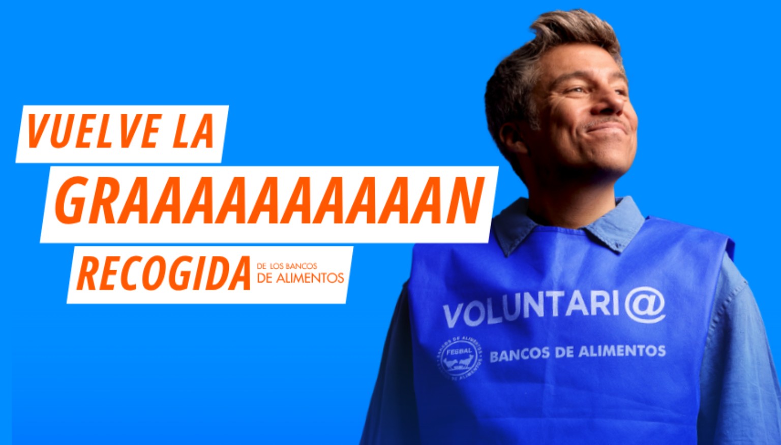 Vuelve la gran recogida de los bancos de alimentos. Voluntario con chaleco azul.